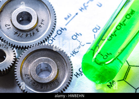 Chemicals tube with reaction formula and mechanical ratchets Stock Photo