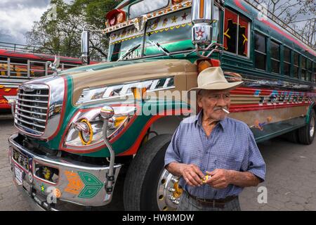 Guatemala, Sacatepequez department, Antigua Guatemala, listed as World Heritage by UNESCO, bus station, chicken bus, former american school bus Stock Photo