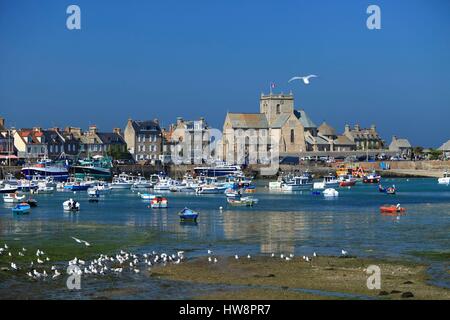 France, Manche, Barfleur, St Nicolas Church in the Port of Barfleur at low tide Stock Photo