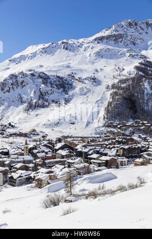 France, Savoie, Val D'Isere, view of the village and Saint Bernard de Menthon church and the Olympic flank of Bellevarde (2827 m), massif de la Vanoise, hight Tarentaise valley Stock Photo