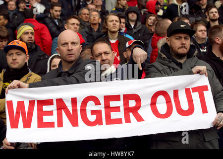 Fans hold up a Wenger Out banner in the stands during the Premier League match at The Hawthorns, West Bromwich. Stock Photo