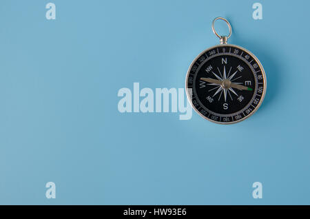 Compass isolated on a blue background Stock Photo