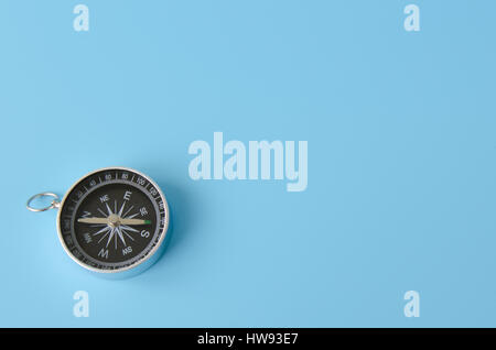 Compass isolated on a blue background Stock Photo