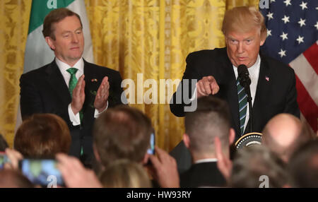 Irish Taoiseach Enda Kenny applauds US President Donald Trump at the annual Shamrock Presentation at the White House in Washington, USA. Stock Photo