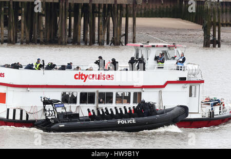 Police officers taking part in a multi-agency exercise, which will test the emergency services' response to a marauding terrorist attack in London, on the river Thames in east London. Stock Photo