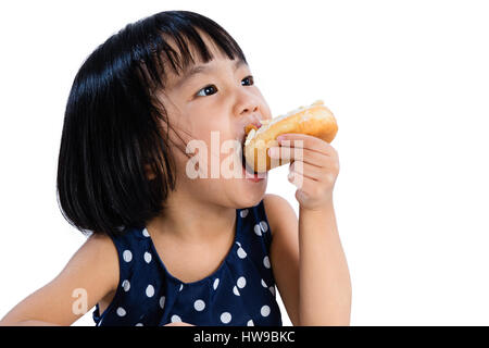 Asian Little Chinese Girl Eating Donuts in isolated White Background Stock Photo