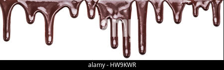Flowing chocolate drops or drops of chocolate glaze isolated on a white background. Stock Photo