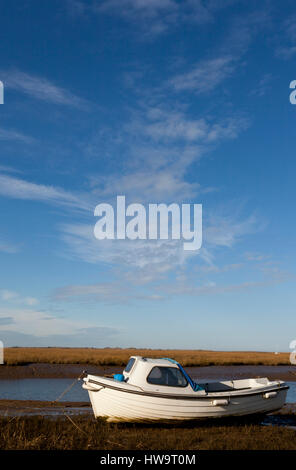 A small boat moored at Blakeney, Norfolk, UK Stock Photo