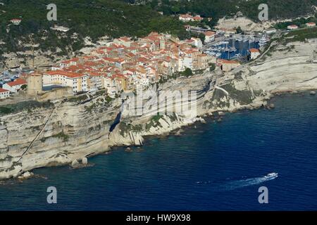 France, Corse du Sud, Bonifacio, the limestone cliffs with the staircase of the King of Aragon, the citadel and the old town (aerial view) Stock Photo