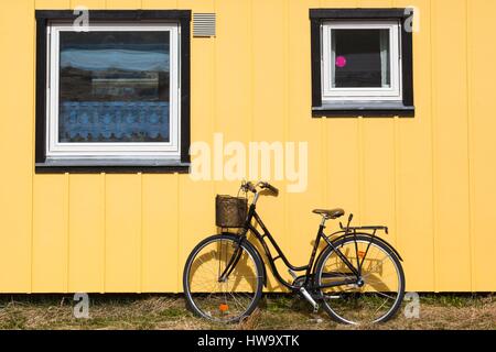 Greenland, Qaqortoq, bicycle and wall Stock Photo