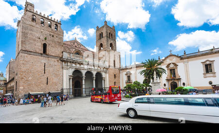 MONREALE, ITALY - JUNE 25, 2011: people and bus on square of Duomo di Monreale town in Sicily. The cathedral of Monreale is one of the greatest exampl Stock Photo