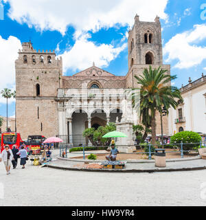 MONREALE, ITALY - JUNE 25, 2011: people and front view of Duomo di Monreale town in Sicily. The cathedral of Monreale is one of the greatest examples  Stock Photo