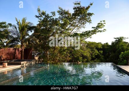 Philippines, Calamian Islands in northern Palawan, Coron Island, Coron Town, The Funny Lion hotel overflowing swimming pool Stock Photo