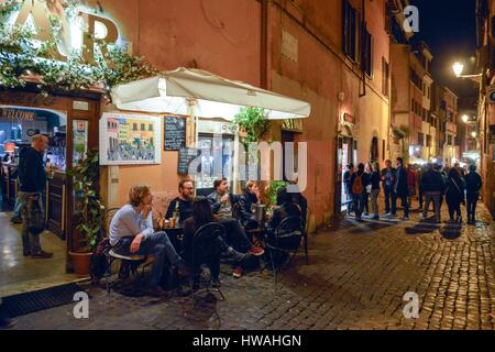 Italy, Lazio, Rome, historical centre listed as World Heritage by UNESCO, district of Trastevere, consumers sat at the table in the terrace of a bar d Stock Photo