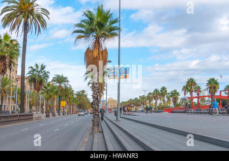 Barcelona, Spain, Nov 3rd, 2013: Tourism economy - Urban outdoors, people take advantage of warm weather.  Walking, running, bicycling & exercising. Stock Photo