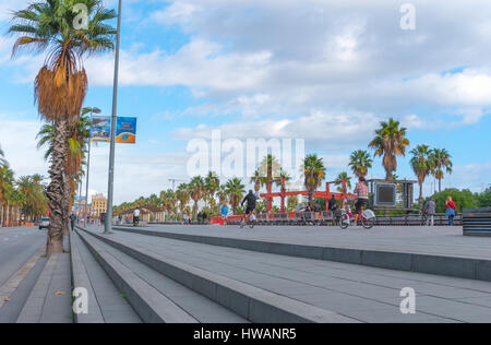 Barcelona, Spain, Nov 3rd, 2013: Tourism economy - Urban outdoors, people take advantage of warm weather.  Walking, running, bicycling & exercising. Stock Photo