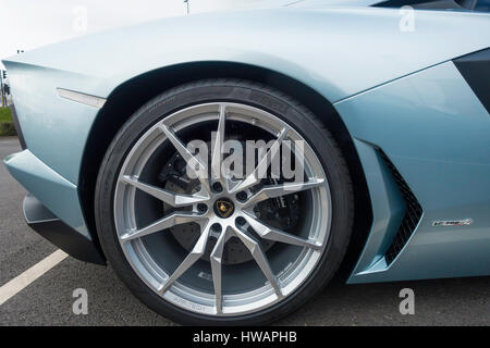 Lamborghini LR-700-4 Sports car detail showing ten spoked alloy wheel and disc brake calipers. Stock Photo