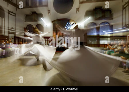 Dancers, whirling dervishes ceremony, Sirkeci Train Station, Istanbul, Turkey Stock Photo