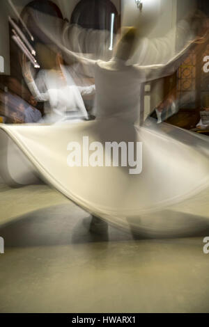 Dancers, whirling dervishes ceremony, Sirkeci Train Station, Istanbul, Turkey Stock Photo