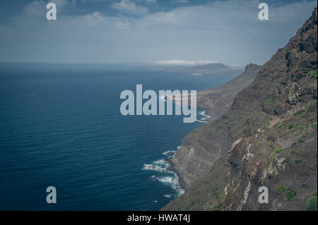 Mountains with agave and sea on the island of Gran Canaria in Spain. Stock Photo