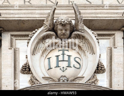 Christogram IHS, facade of the Church of the Gesu, mother church of the Society of Jesus, Rome, Italy Stock Photo