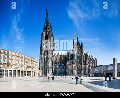 COLOGNE - MAY 14: Panoramic view of tourists in front of the Cologne Cathedral on Roncalliplatz in Germany on May 14, 2015 Stock Photo