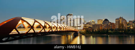 Calgary cityscape with Peace Bridge and downtown skyscrapers in Alberta at night, Canada. Stock Photo