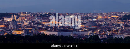 Rome rooftop panorama view with skyline and ancient architecture in Italy at night. Stock Photo