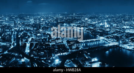 London aerial view panorama at night with urban architectures and bridges. Stock Photo