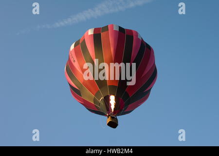 Balloon firing up against a blue sky Beaconsfield,Surrey. Stock Photo