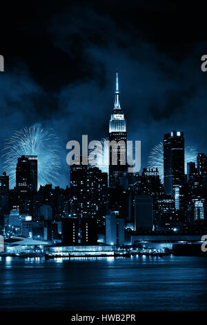 NEW YORK CITY - JUL 4: Empire State Building with fireworks on July 4, 2015 in Manhattan, New York City. With population of 8.4M, it is the most popul Stock Photo