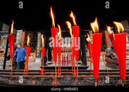 China, Sichuan Province, Dujiangyan, Dujiangyan irrigation system and Qingcheng Mountain listed as World Heritage by UNESCO, candles in a Taoist temple Stock Photo