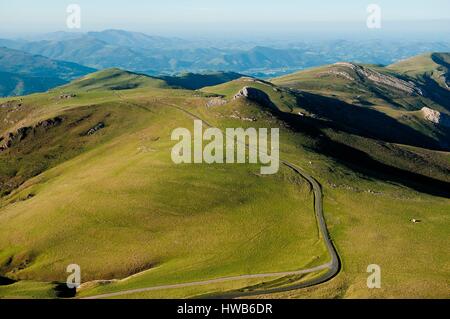 France, Pyrenees Atlantiques, the road in the French Pyrenees, between Saint Jean Pied de Port and Roncevaux, at the approach of the pass of Bentarte which marks the Franco-Spanish border (aerial view) Stock Photo