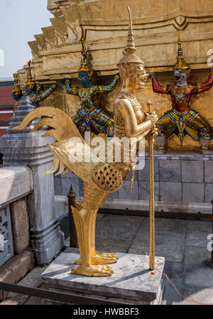 November 14, 2006 - Bangkok, Thailand - Golden statues of half-human, half-bird creatures known as the Kinnara and Kinnari, in the Grand Palace Complex in Bangkok. In Buddhist mythology, they watch over human welfare in times of trouble or danger. Thailand has become a favorite tourist destination. (Credit Image: © Arnold Drapkin via ZUMA Wire) Stock Photo