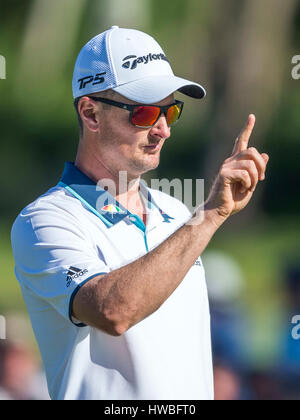 Justin Rose, of England, lines up his putt on the 14th green during the ...