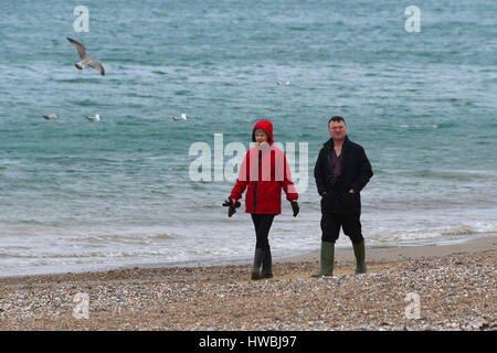 Weymouth, Dorset, UK. 20th Mar, 2017. UK Weather. Walkers on the beach on a cold, overcast and breezy day at the seaside resort of Weymouth in Dorset. Photo Credit: Graham Hunt/Alamy Live News Stock Photo