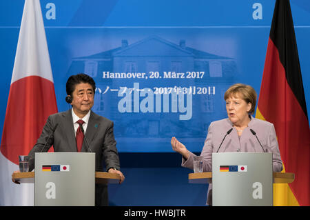 Hanover, Germany. 20th Mar, 2017. German Chancellor Angela Merkel and Japanese Prime Minister Shinzo Abe stand together in the Herrenhaeuser Orange Gardens in Hanover, Germany, 20 March 2017. Merkel is meetinfg Abe for bilateral talks on the side of the computer trade fair CeBIT. Photo: Peter Steffen/dpa/Alamy Live News Stock Photo