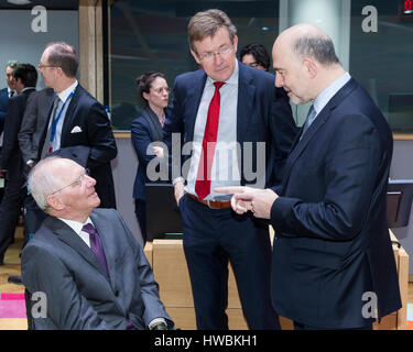 Brussels, Belgium. 20th Mar, 2017. German Finance Minister Wolfgang Schaeuble (L) is talking with the Belgian Finance Minister Johan Van Overtveldt (C) and the EU Economic and Financial Affairs, Taxation and Customs Commissioner Pierre Moscovici (R) prior an Eurogroup Ministers meeting in the Europa building, the EU Council headquarter. Credit: dpa picture alliance/Alamy Live News Stock Photo