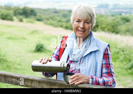 Senior Man On Hike Having Hot Drink Stock Photo