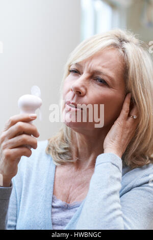 Mature Woman Experiencing Hot Flush From Menopause Stock Photo