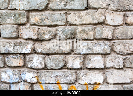 Old weathered white brick wall as background Stock Photo