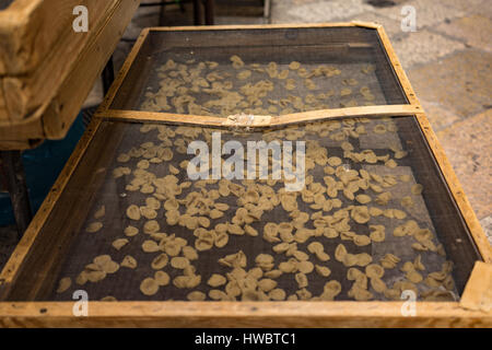 Orecchietti pasta shells in old town Bari, Italy Stock Photo