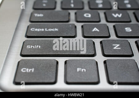 Modern laptop keyboard closeup. Shallow depth of field. Stock Photo