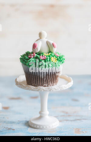 Easter bunny on  the top of cup cake,selective focus Stock Photo