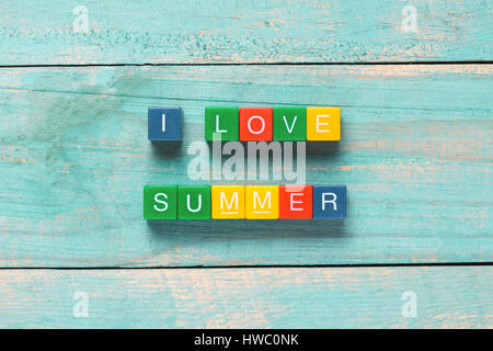 I LOVE SUMMER written in colorful wooden blocks on a beach Stock Photo