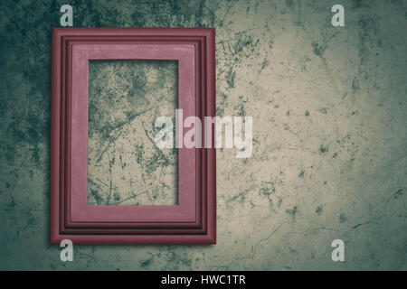 Old photo frame on concrete background. Stock Photo