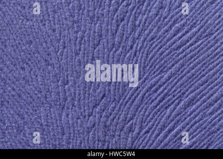 Violet background from a soft wool textile material closeup. Fabric with natural texture. Cloth backdrop. Stock Photo