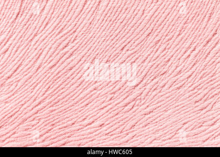 Light pink background from a soft wool textile material closeup. Fabric with natural texture. Stock Photo
