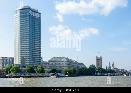 Millbank Tower, Thames House and the Palace of Westminster seen from the River Thames, London, England, UK Stock Photo