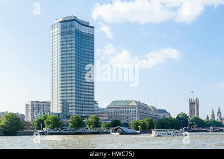 Millbank Tower on the banks of the River Thames, with Thames House and the Palace of Westminster beyond, London, UK Stock Photo